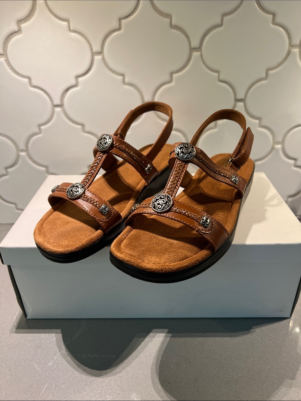 Minnetonka Brown Leather Slingback Sandals with Silver Conchos